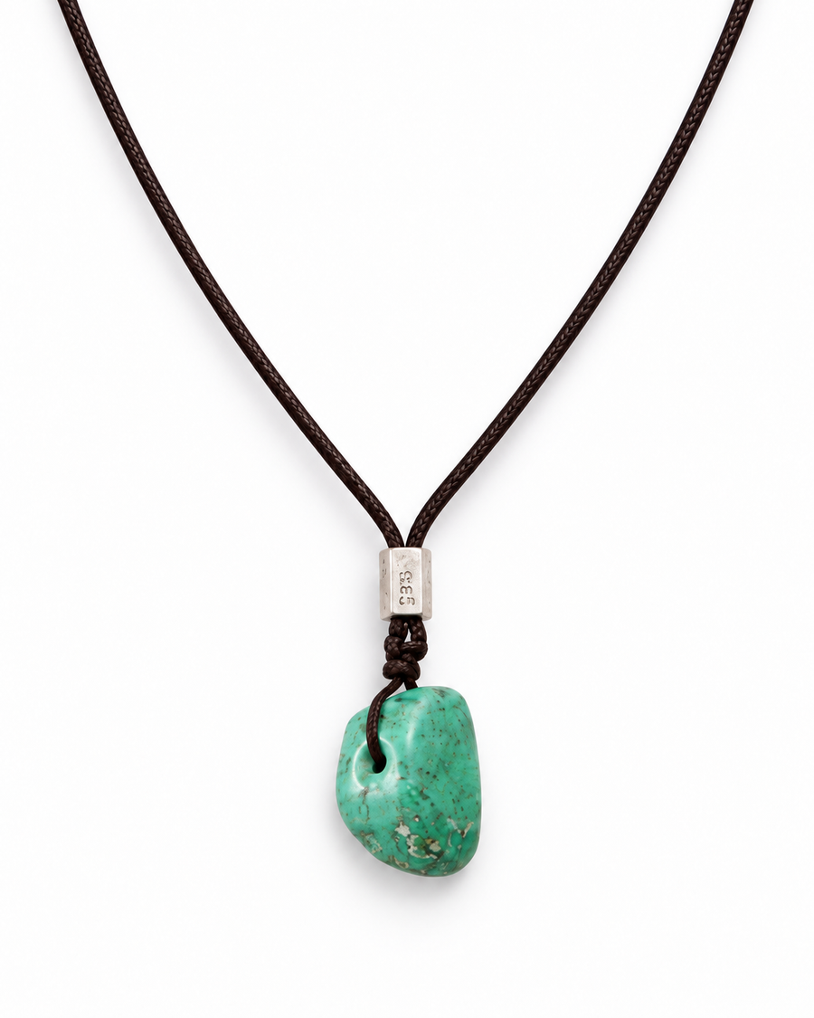 Quiet Current — enlarged turquoise pendant and lower cord V on white