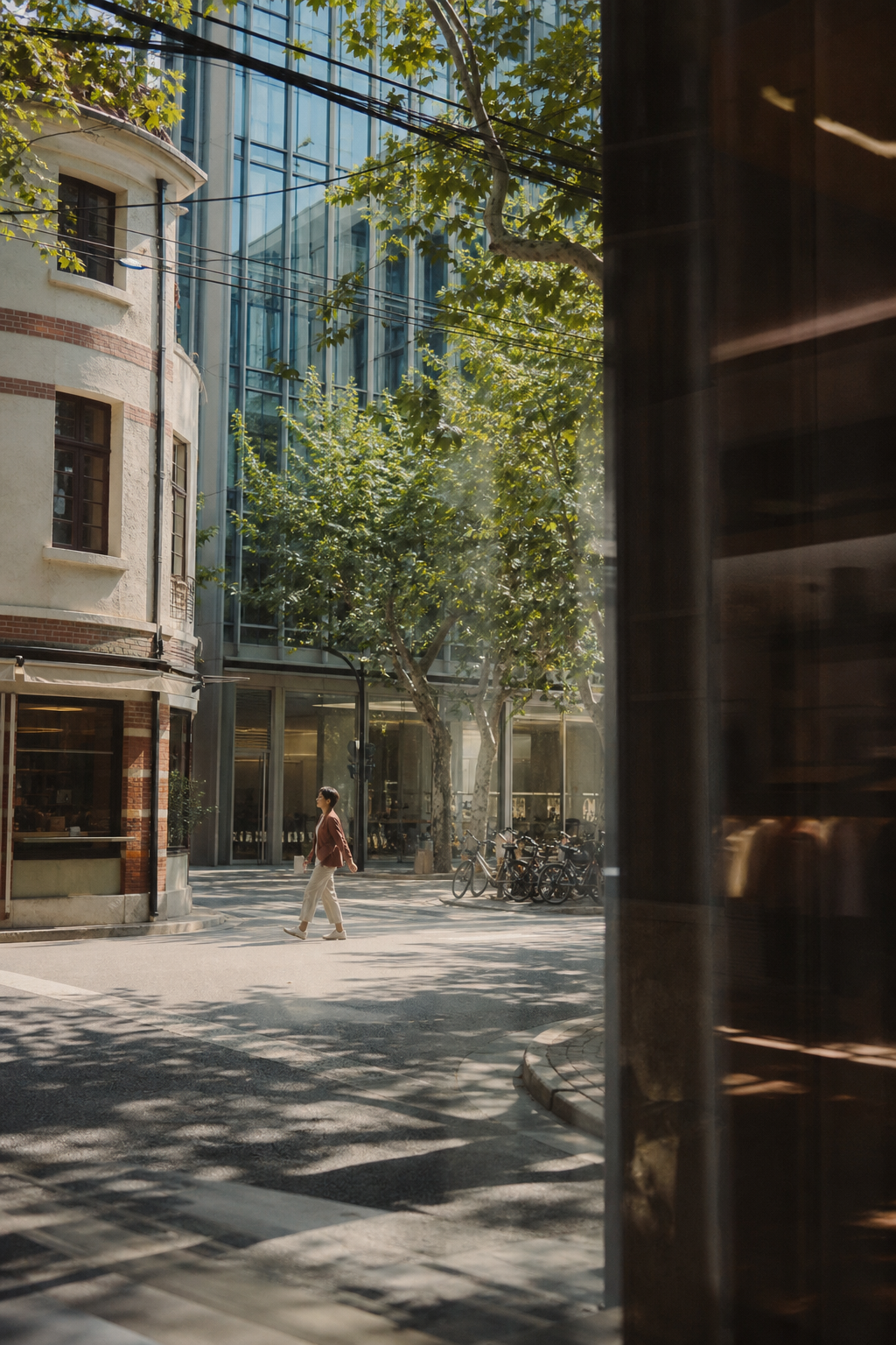 A quiet pedestrian moment on a sunlit Shanghai street
